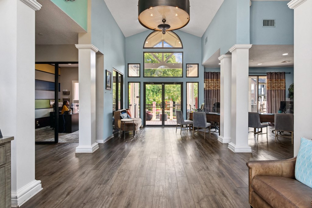 A large room with a couch and a table.